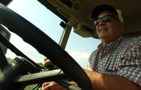 Man driving across conservation land